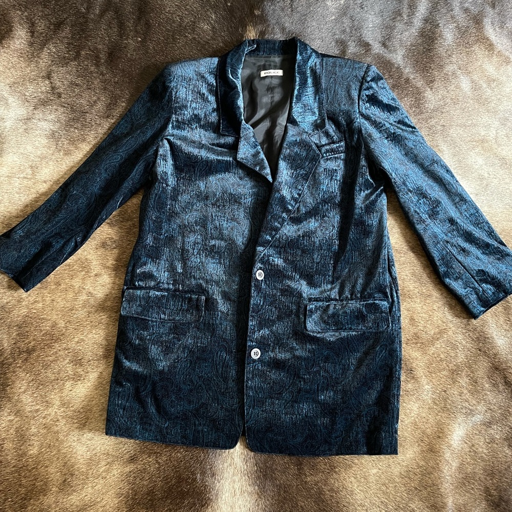 Suit coat . Can be worn by a man or woman